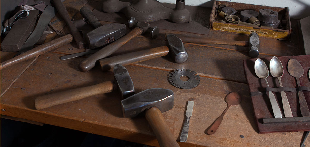 bench of silversmithing tools and implements